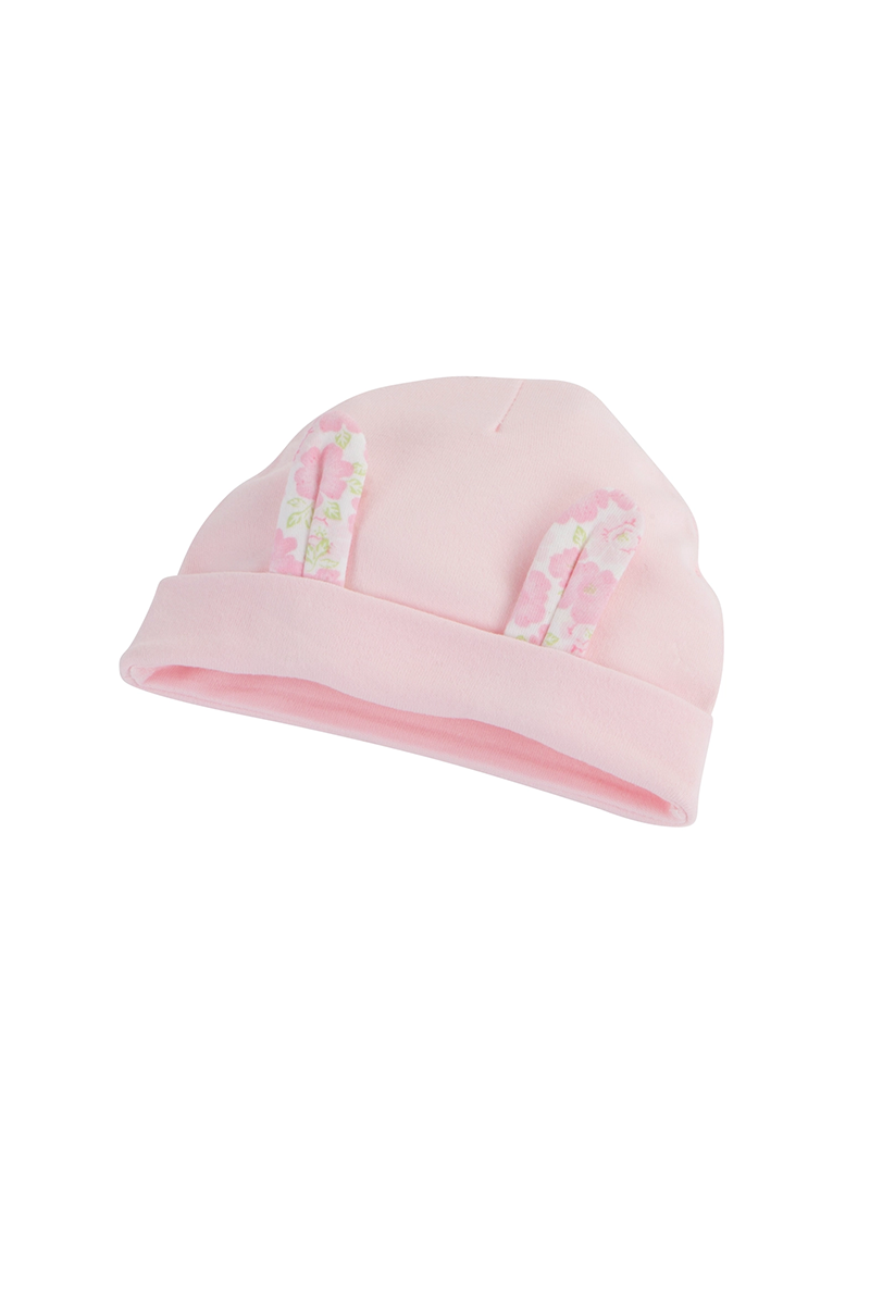 Pink baby hat with bunny ears on a white background