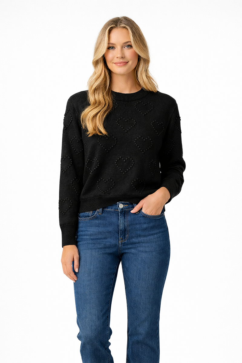 Woman wearing a black sweater and blue jeans on a white background