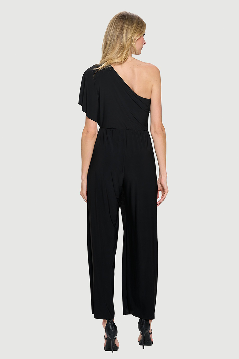 Woman wearing a black one-shoulder jumpsuit on a white background