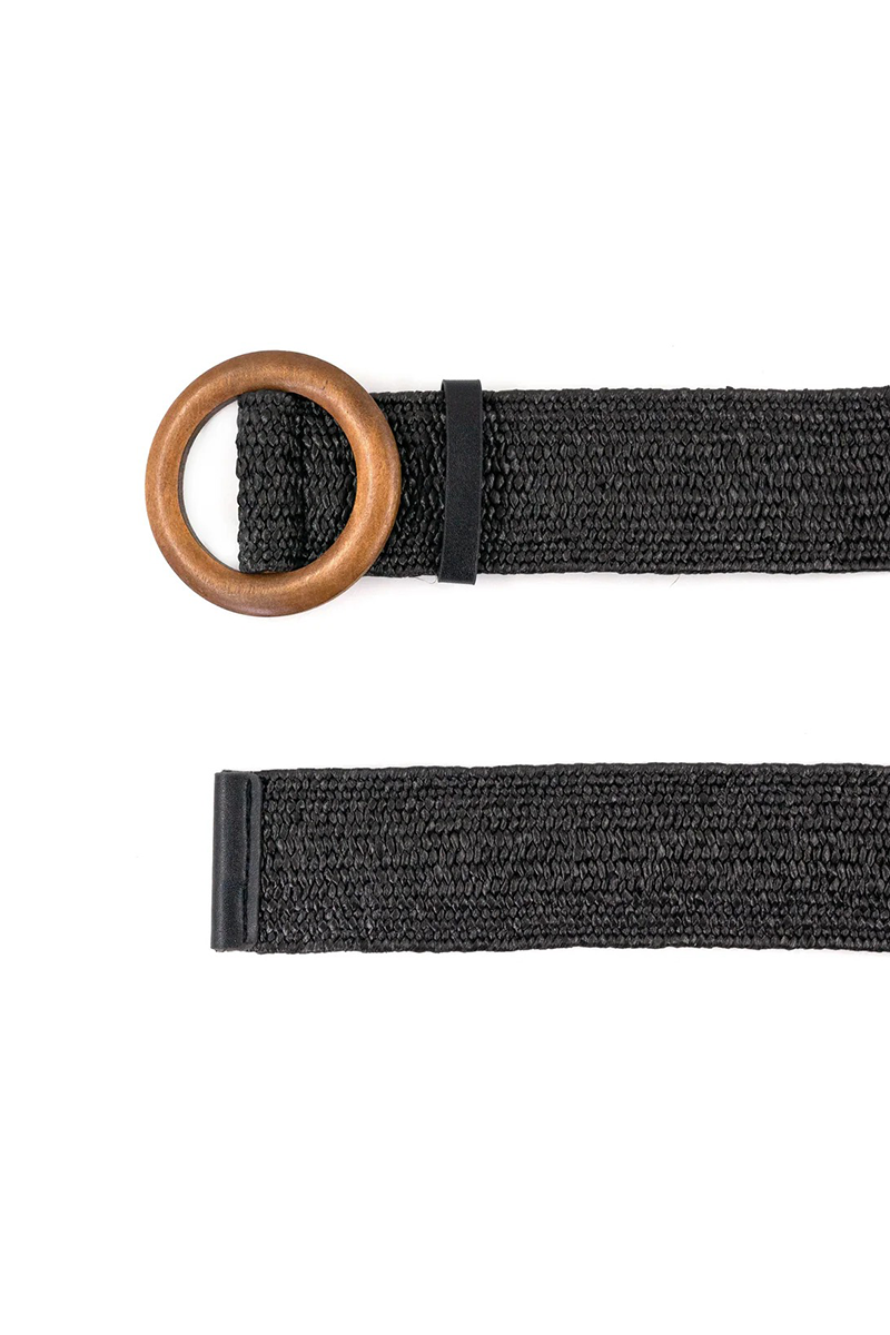 Black straw belt with a wooden ring on a white background