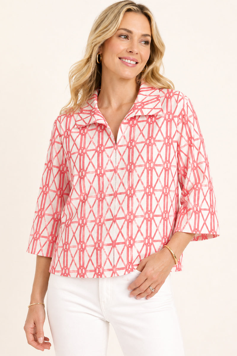 Woman wearing Coral and Pink Bamboo 3/4 Sleeve Blouse with white pants