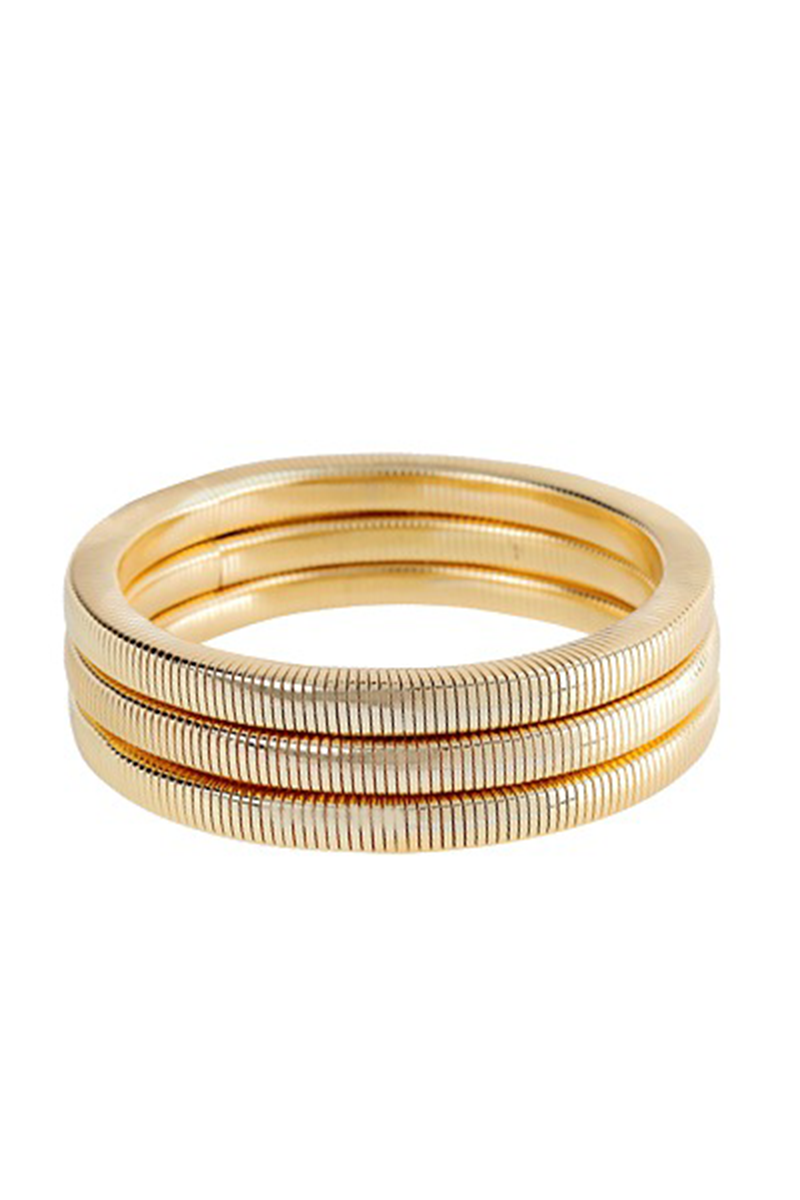 Three gold rings stacked on a white background