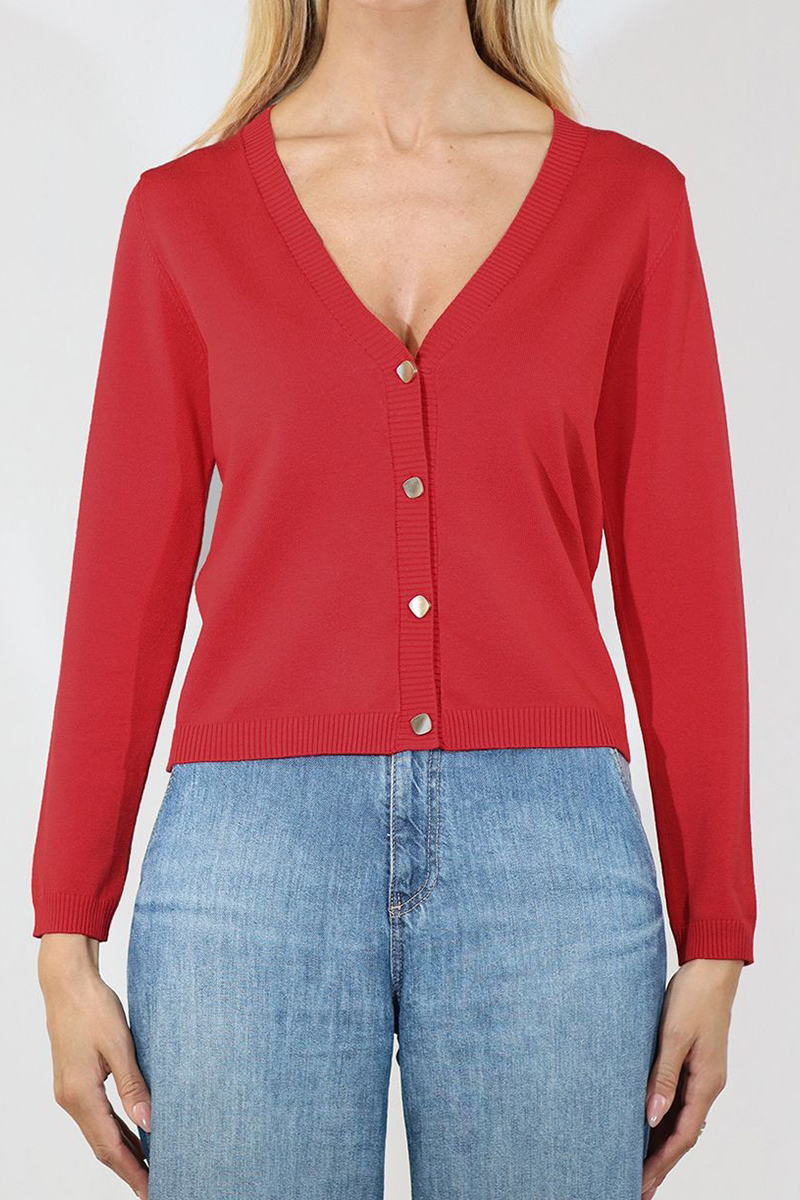 Red cardigan worn by a person on a white background