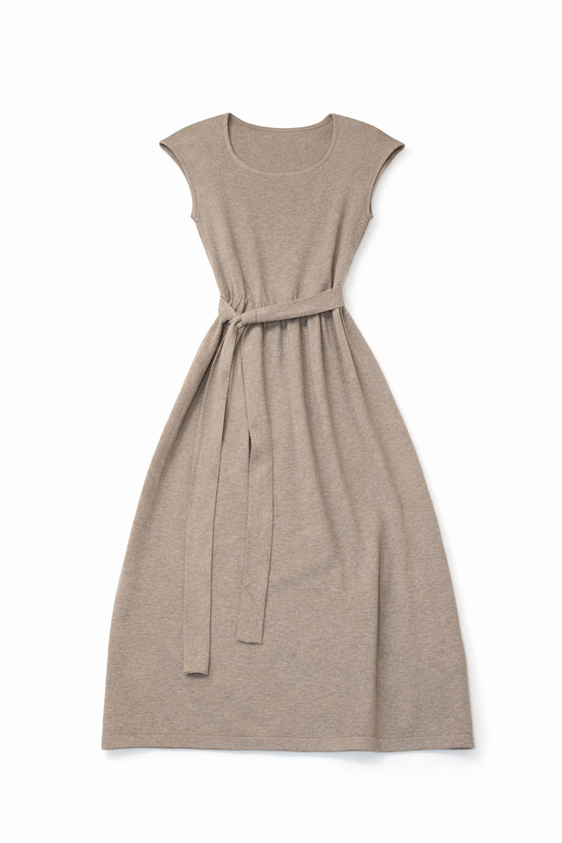 Beige dress with a belt on a white background