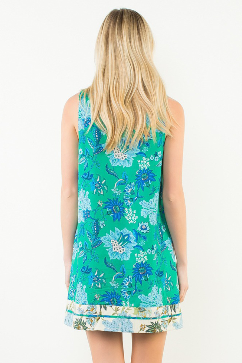 Woman wearing a floral dress with a white background