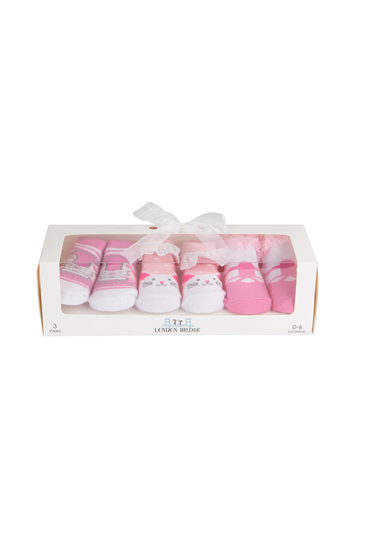 Set of baby socks in a decorative box with a white ribbon on a white background