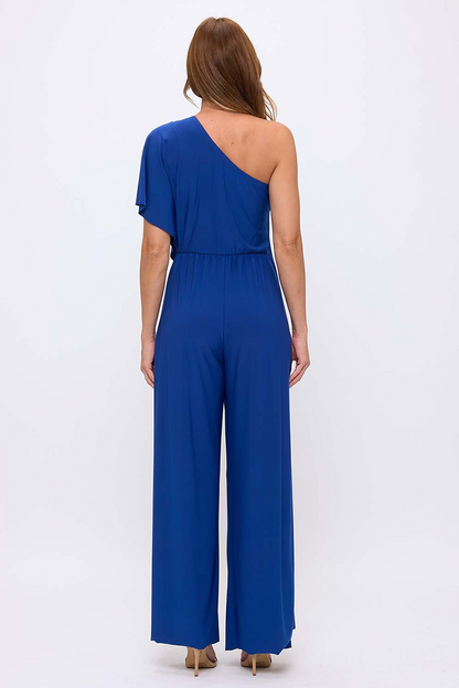 Woman wearing a blue one-shoulder jumpsuit on a white background