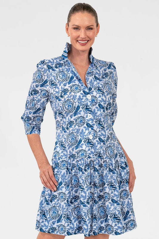Woman wearing a blue floral dress on a white background