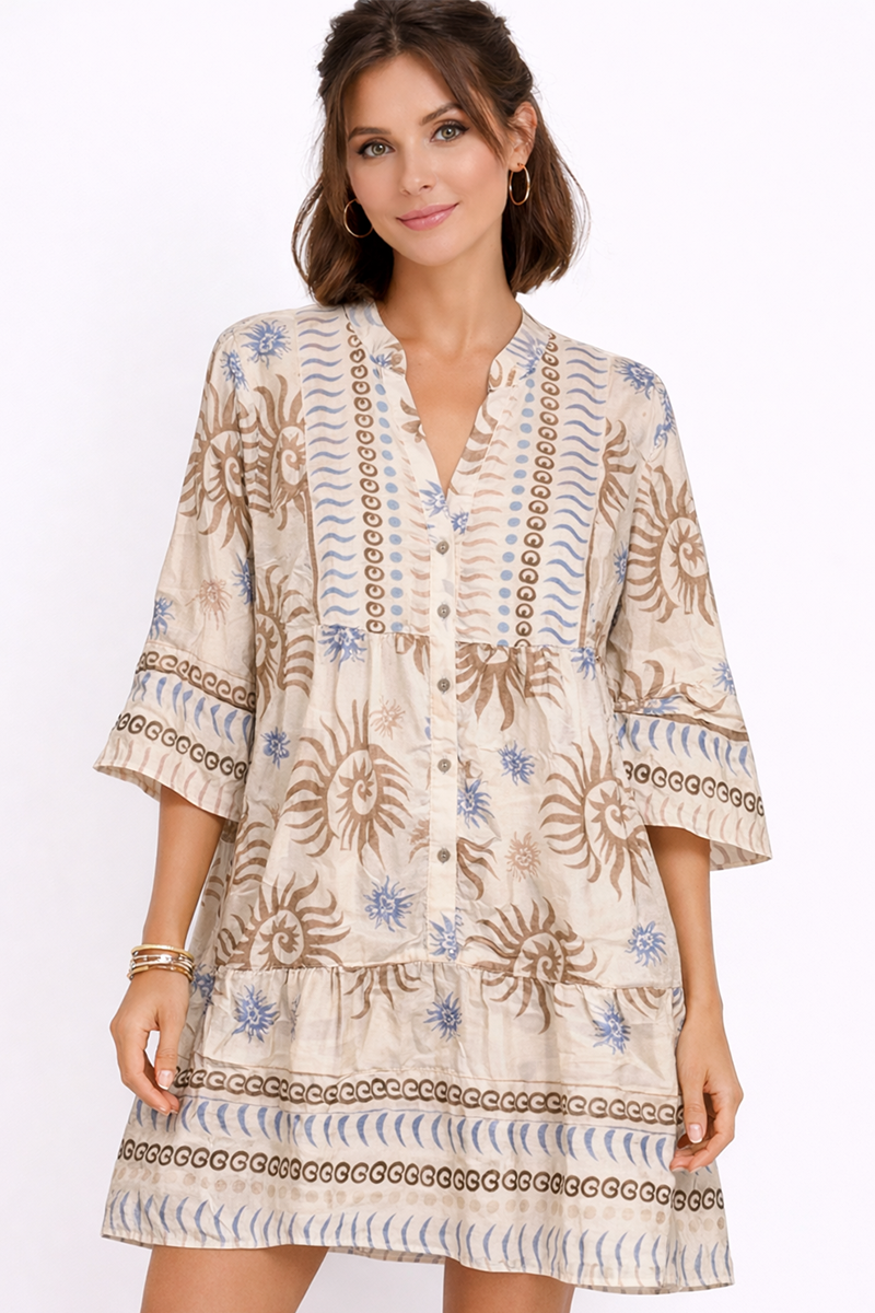 Woman wearing a patterned dress on a white background