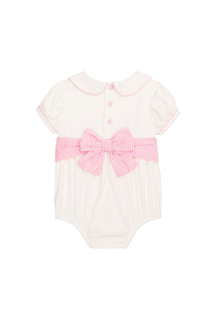 White baby romper with pink bow and collar on a white background