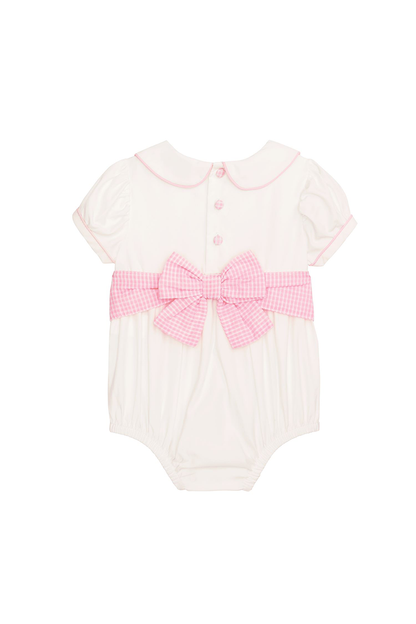 White baby romper with pink bow and collar on a white background