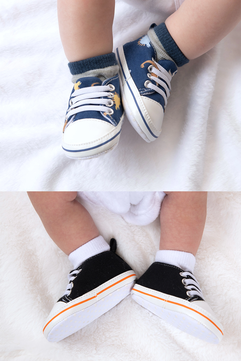 Two sets of children's shoes on a white background