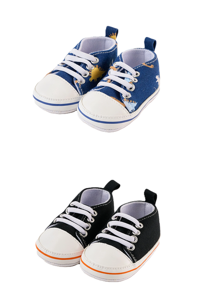 Pair of blue and black baby shoes on a white background
