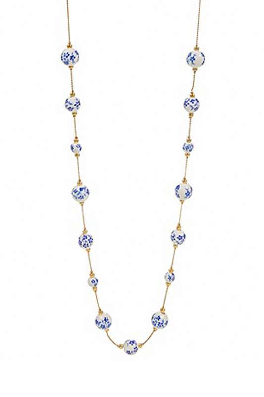 Necklace with blue and white ceramic beads on a white background