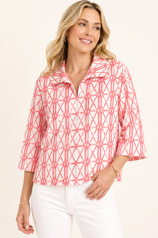 Woman wearing Coral and Pink Bamboo 3/4 Sleeve Blouse with white pants