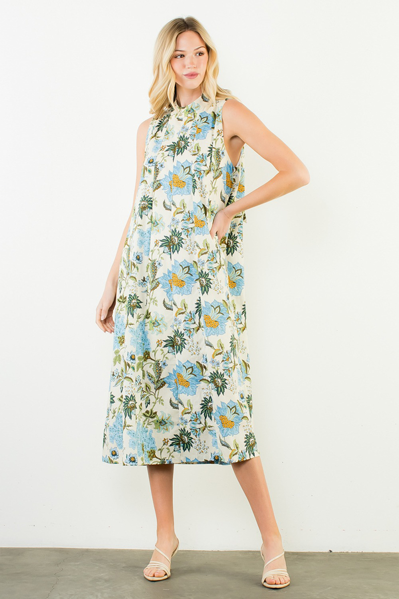 Woman wearing a floral dress against a white background