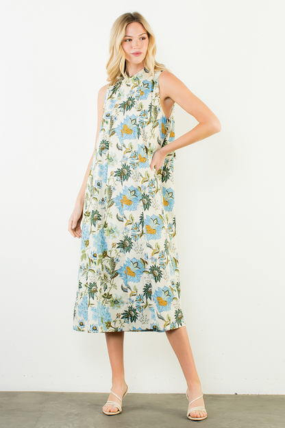 Woman wearing a floral dress against a white background