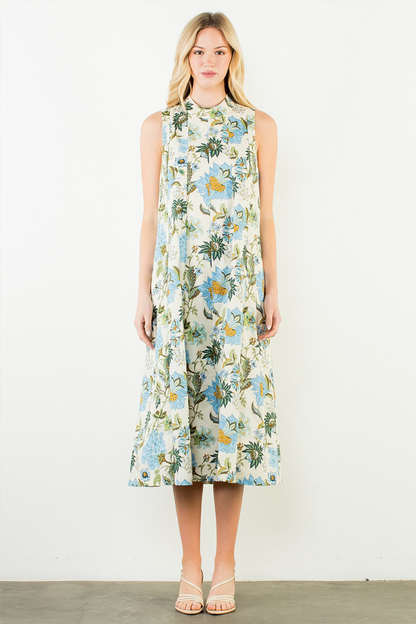 Woman wearing a floral sleeveless dress on a white background