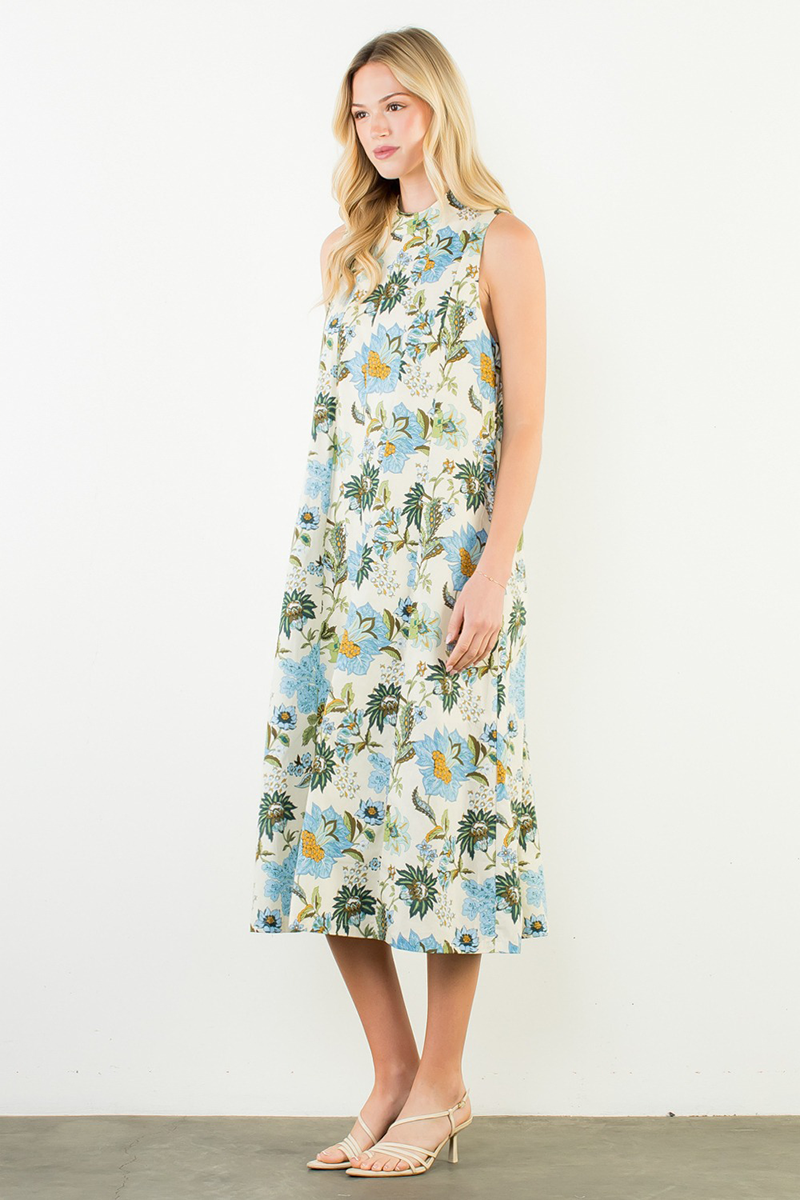 Woman wearing a floral dress on a white background