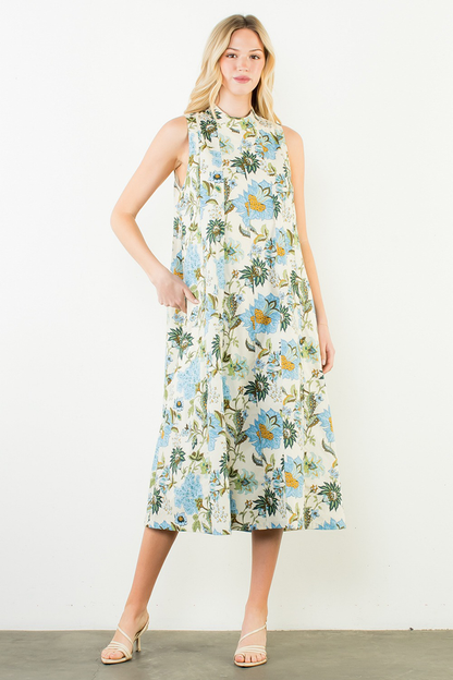 Woman wearing a floral dress against a white background