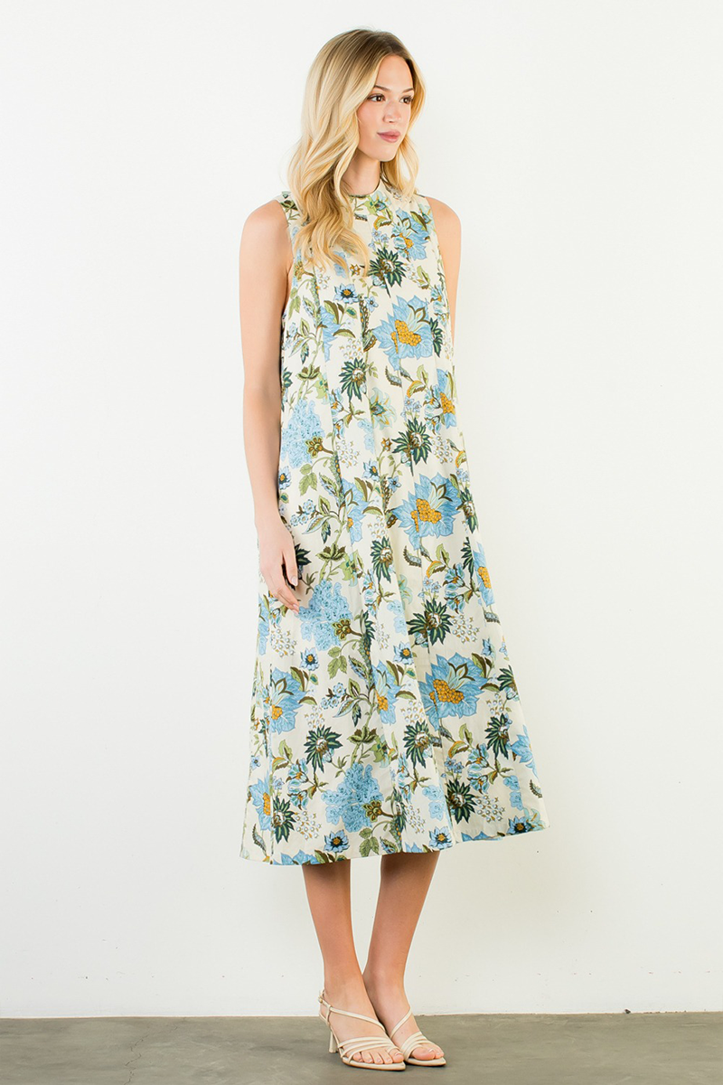 Woman wearing a floral dress against a white background