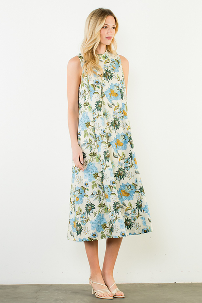 Woman wearing a floral dress against a white background