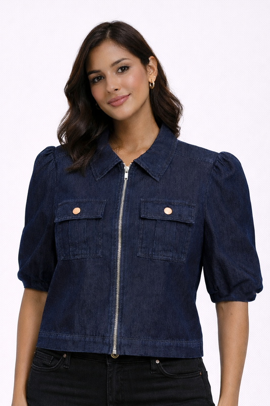 Woman wearing a navy blue denim jacket on a white background