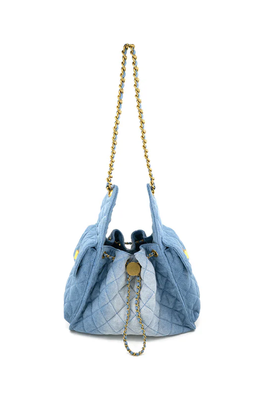 Blue quilted handbag with gold chain strap on a white background