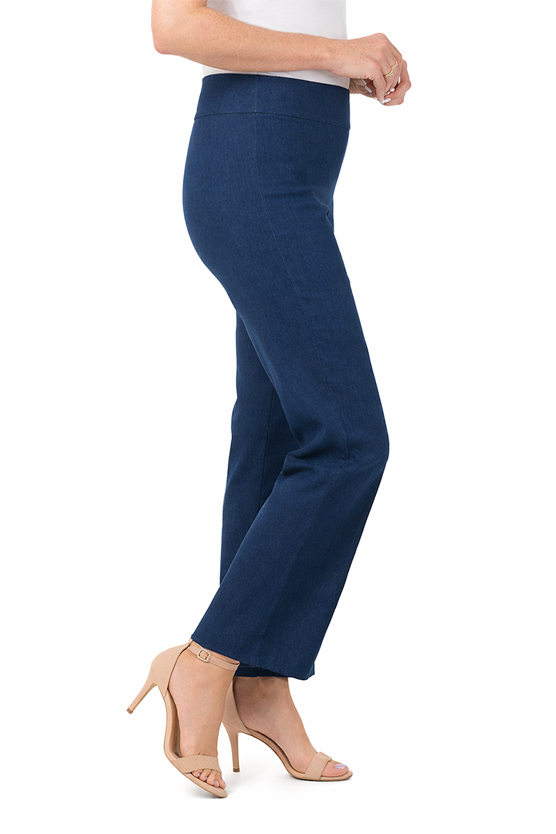Navy denim blue pants worn by a person on a white background