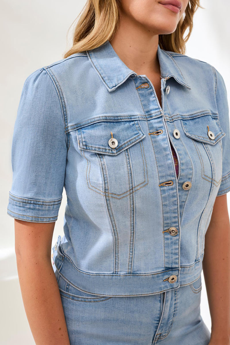 Light blue denim jacket and jeans worn by a person on a white background