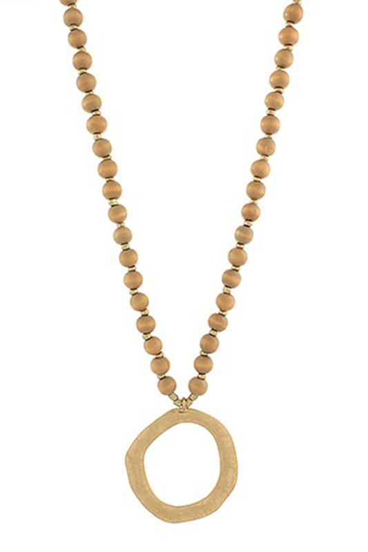 Necklace with tan wooden beads and a large gold pendant on a white background