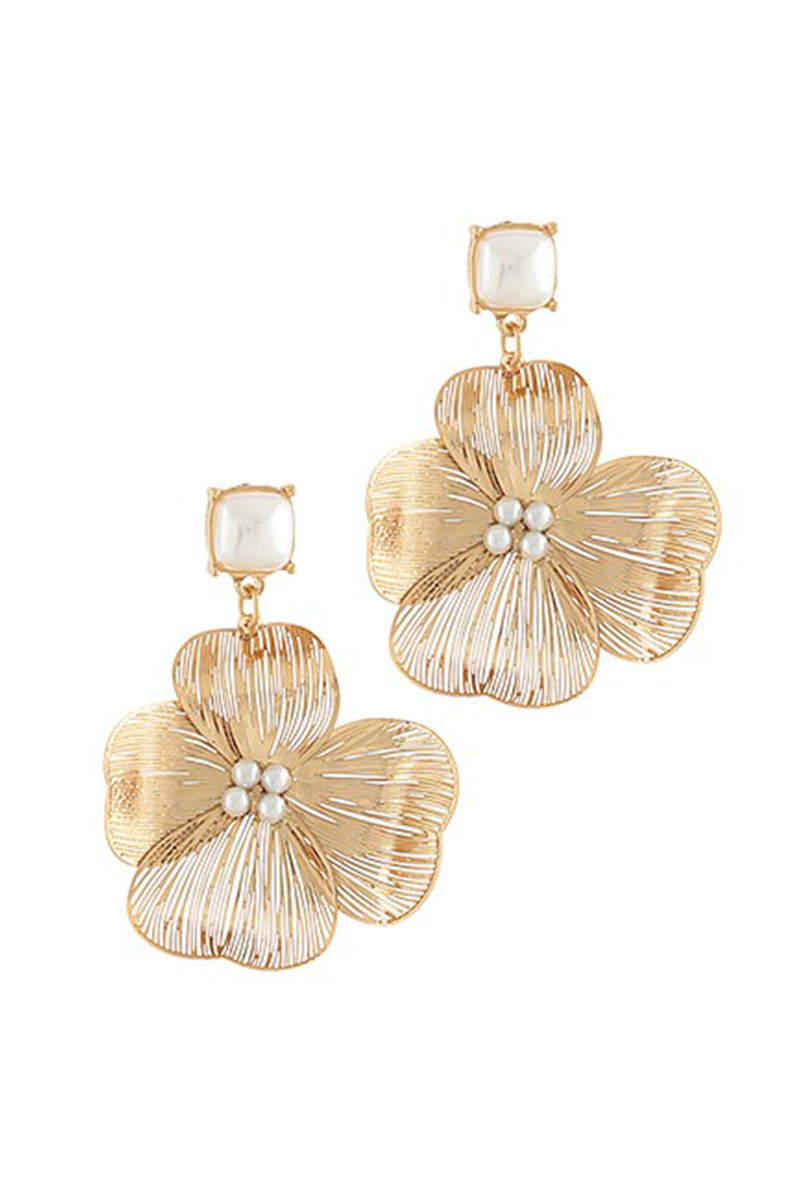 Gold floral earrings with pearl centers on a white background