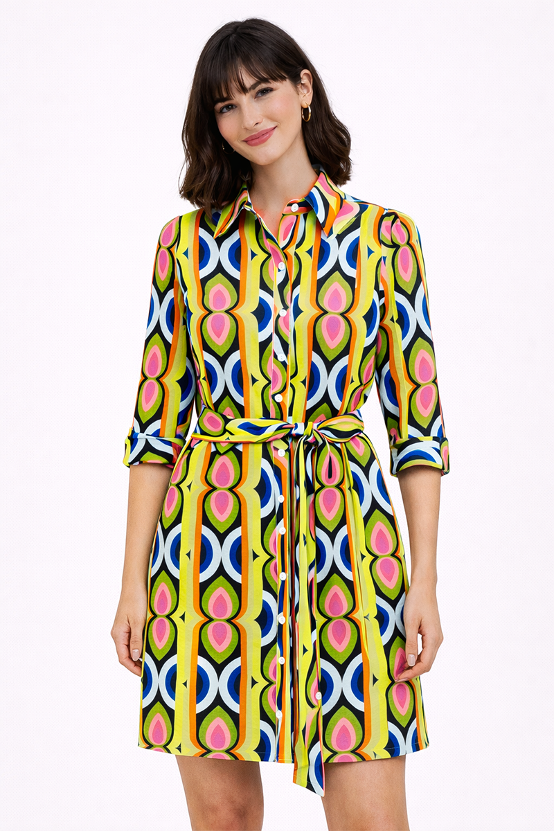 Woman wearing a colorful patterned dress on a white background