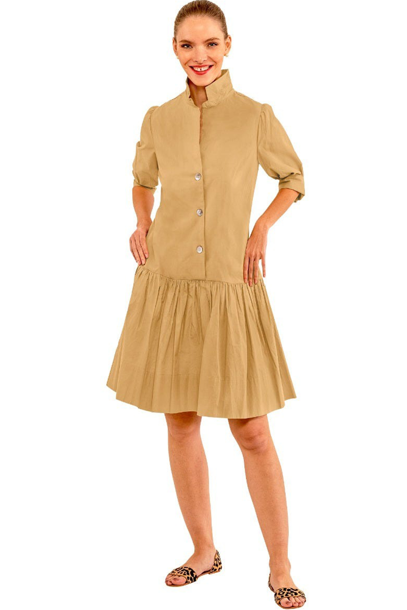 Woman wearing a beige dress on a white background