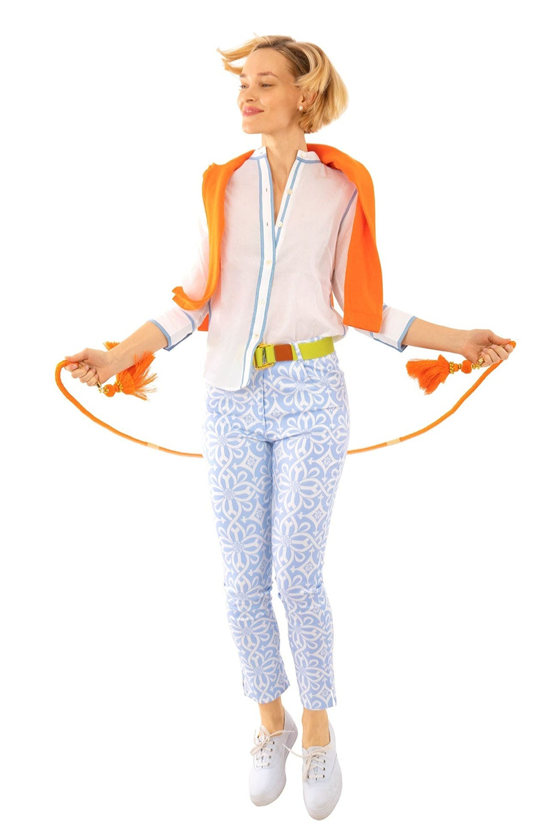 Woman holding a skipping rope on a white background