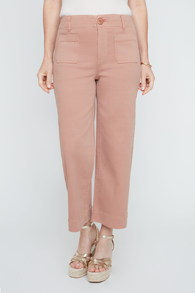 Person wearing pink pants on a white background