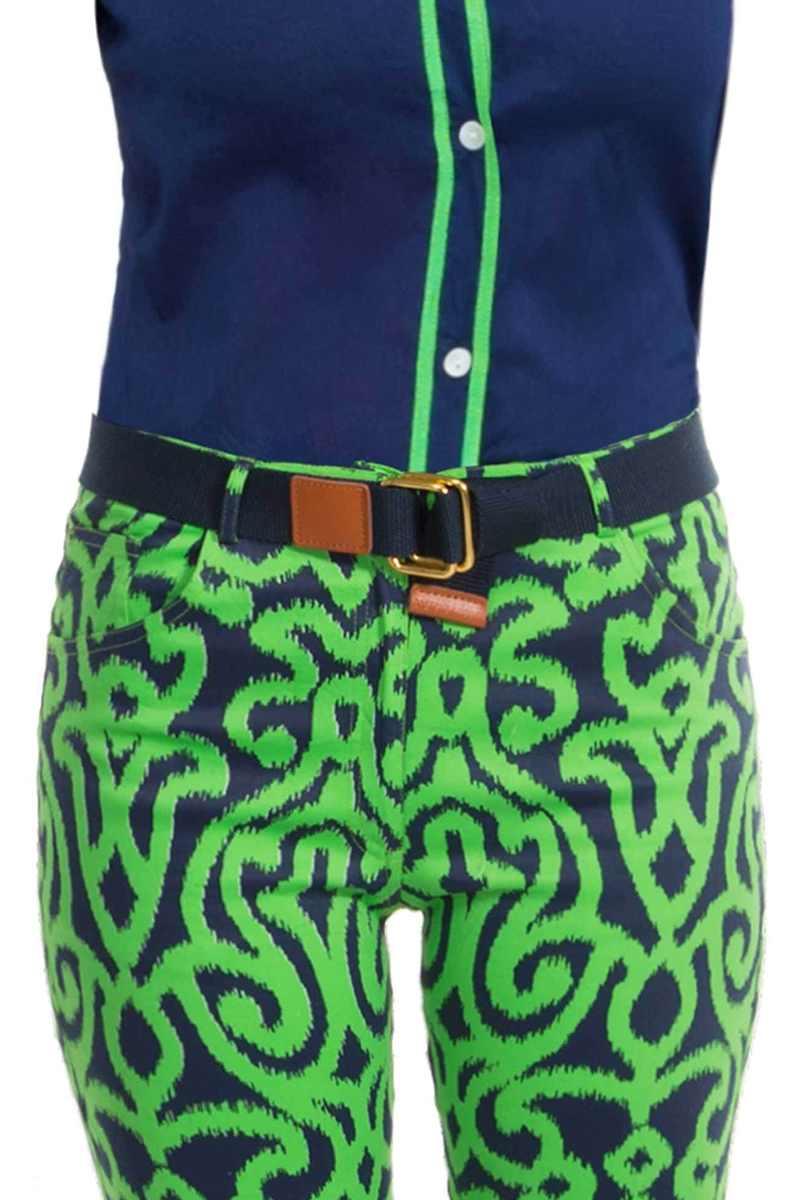 Green and blue patterned pants with a navy belt on a white background
