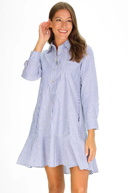 Woman wearing a blue and white striped dress on a white background