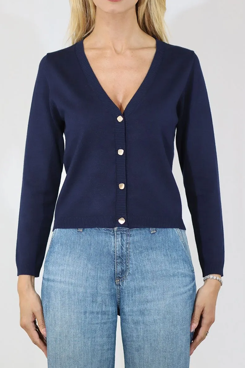 Navy cardigan worn by a person on a white background
