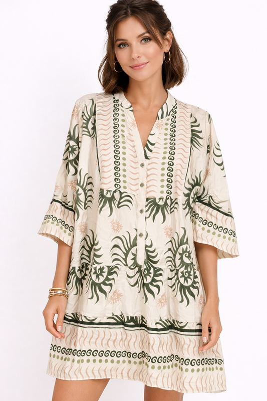 Woman wearing an olive and beige printed dress