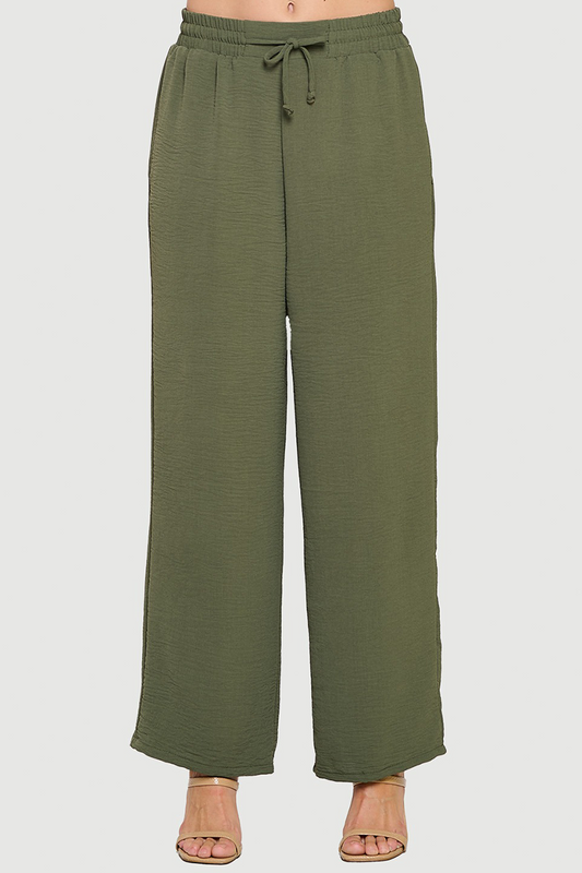 Green wide-leg pants on a white background