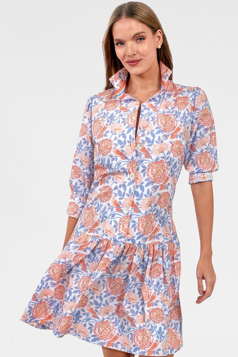 Woman wearing a floral dress with a white background