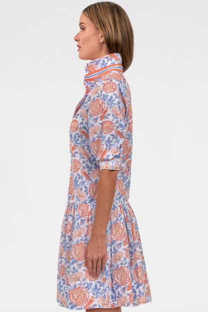 Woman wearing a floral dress with a white background