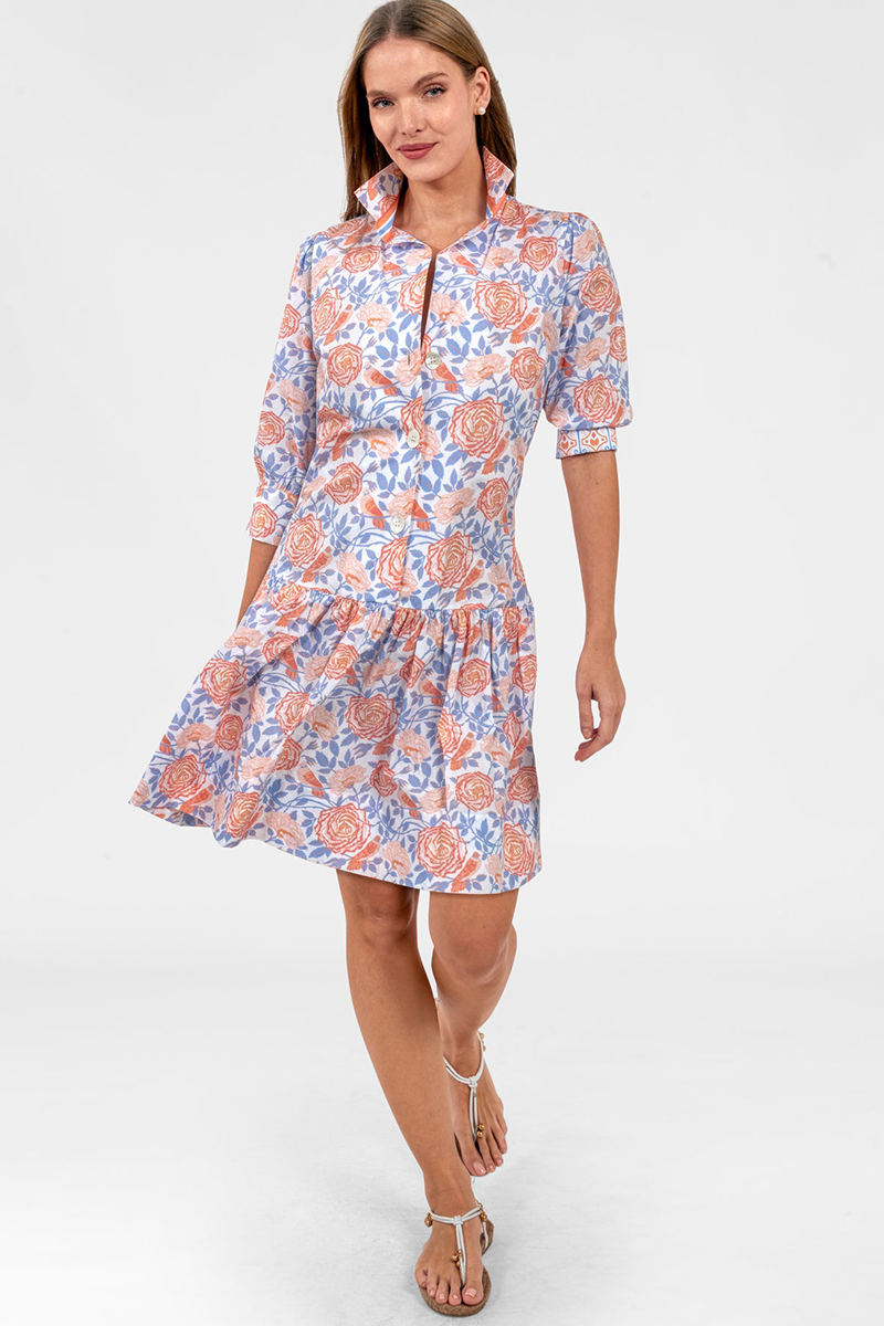 Woman wearing a floral dress on a white background