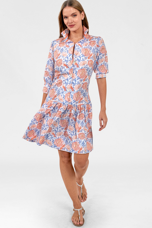 Woman wearing a floral dress on a white background