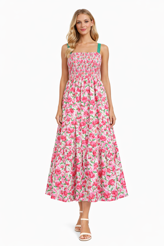 Woman wearing a pink floral dress on a white background