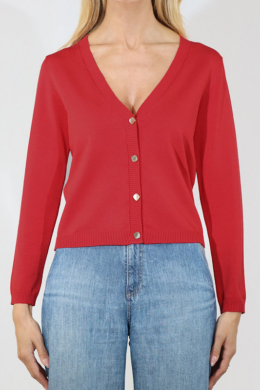 Red cardigan worn by a person on a white background