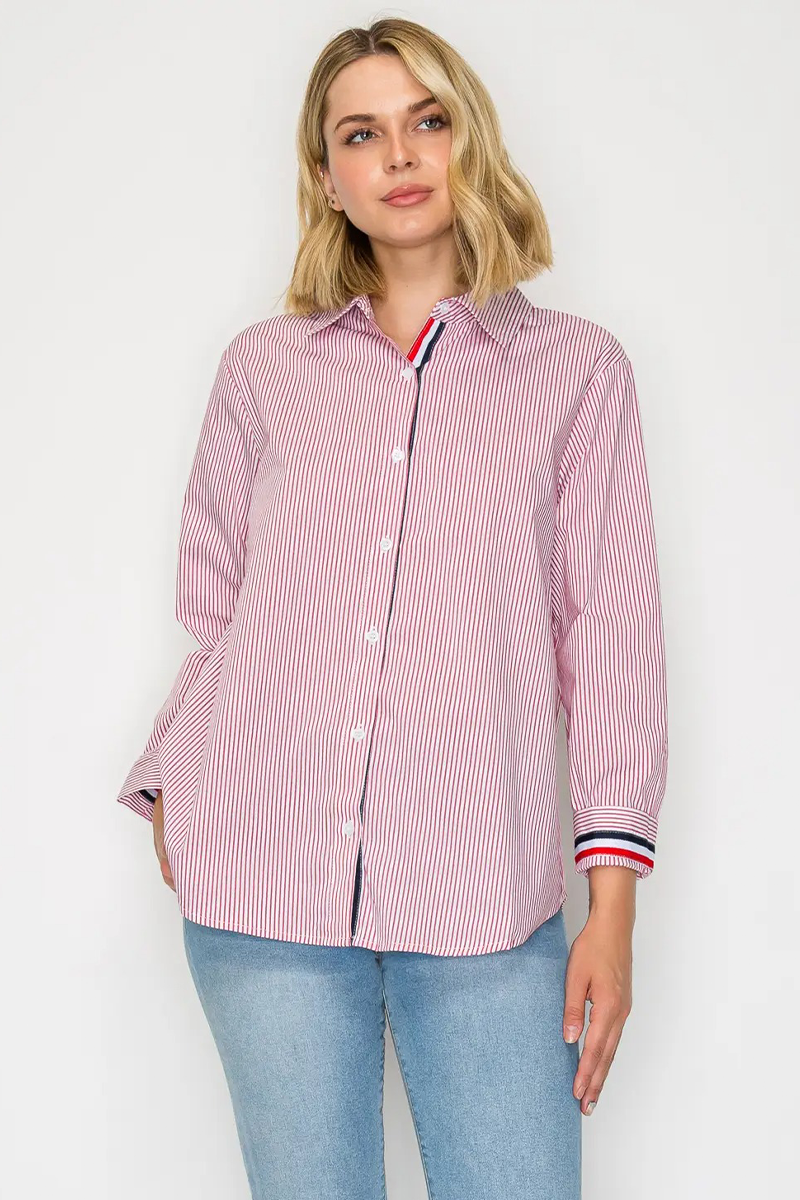 Woman wearing a pink and white striped shirt with blue jeans on a white background
