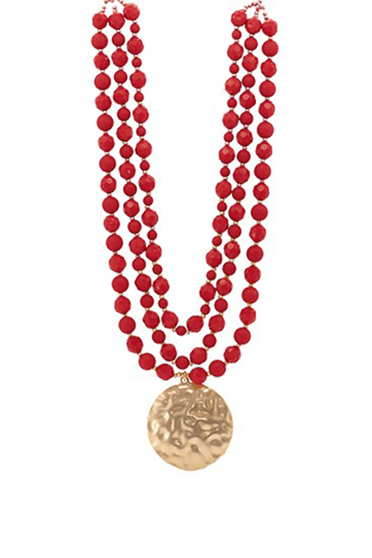 Red beaded necklace with a gold pendant on a white background