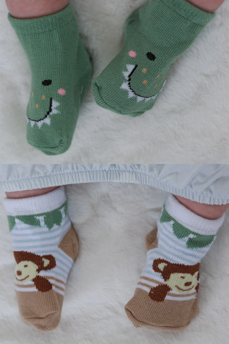 Children's socks with animal designs on a white background